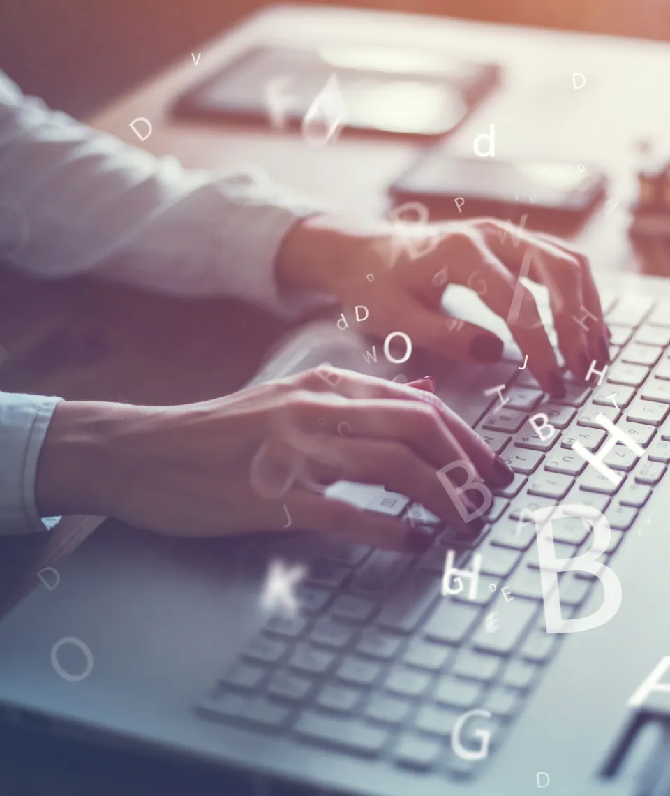 Businesswoman typing on laptop
